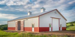 Large red metal barn building