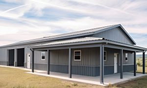 30x70 hybrid garage/shop building with two parking bays, a covered porch, and gray steel siding, ideal for workshops or farm storage