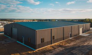 6,000 Sq Ft Industrial PEMB structure, multiple entry points, set on a commercial lot near New Orleans