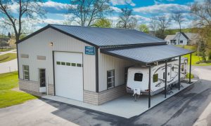 22x30 steel building workshop with an attached RV shelter canopy lean-to in a residential area