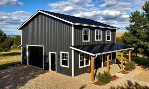 2 story barndominium with garage and porch in dark gray and black