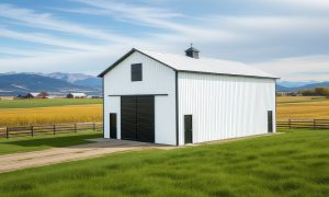rustic barn in white and black with large sliding doors and roof cupola