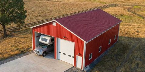 An aerial shot of a camper shed with two bays in red and white