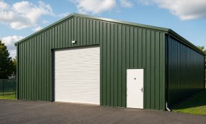 A newly constructed 30x60 metal building in green and white