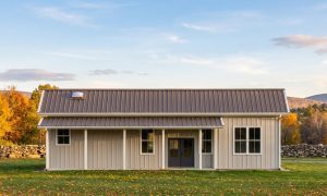 The Orchard 40×50 barndominium front elevation (south on the plan), photoreal render: 3:12 gable, the 36 foot front porch
