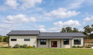 The Ridge 30×80 barndominium front elevation (south on the plan), photoreal render: 3:12 gable, the 36 foot front porch